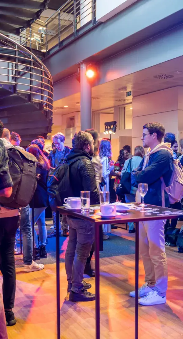 Attendees discussing at React Brussels